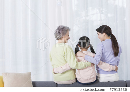 three generations of women, Asian grandmother, mother and grand daughter 77913286