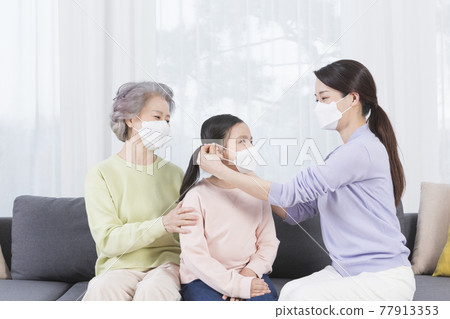 three generations of women, Asian grandmother, mother and grand daughter wearing mask three generations of women, Asian grandmother, mother and grand daughter wearing mask 77913353