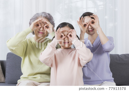 three generations of women, Asian grandmother, mother and grand daughter 77913378