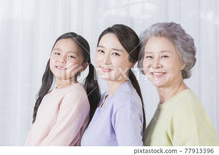 three generations of women, Asian grandmother, mother and grand daughter 77913396