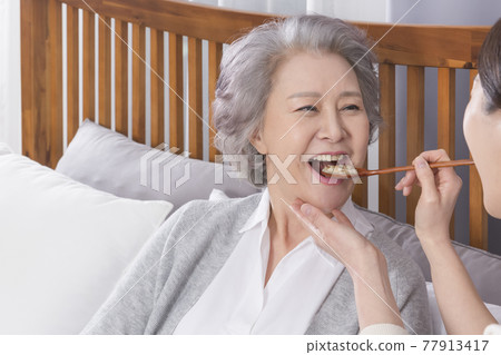 Asian caregiver and old woman at nursing home, hospital Asian caregiver and old woman at nursing home, hospital 77913417