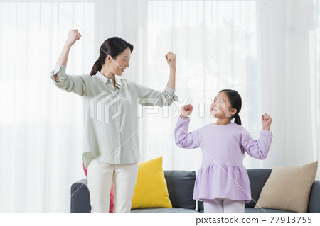 happy Asian mom and young daughter happy Asian mom and young daughter 77913755