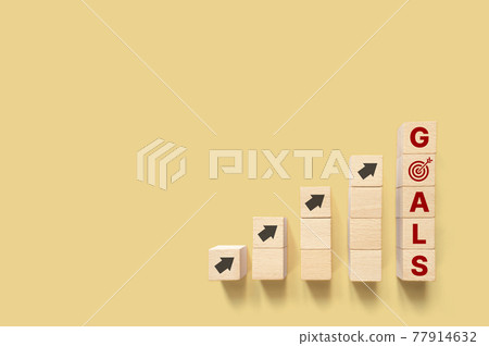 Growth business to goals concept. Wooden block cube shape with arrow moving up and copy space 77914632