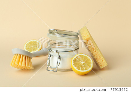 Cleaning concept with eco friendly cleaning tools on beige background Cleaning concept with eco friendly cleaning tools on beige background 77915452