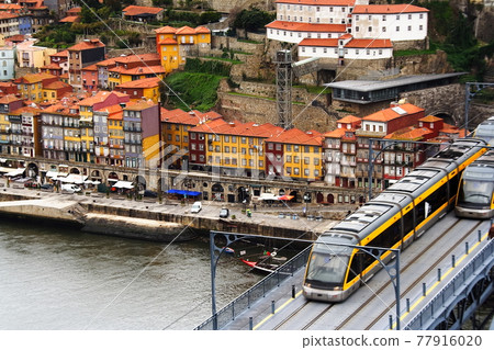 Don Luis I Bridge and tram over the Douro River in Porto, Portugal 77916020