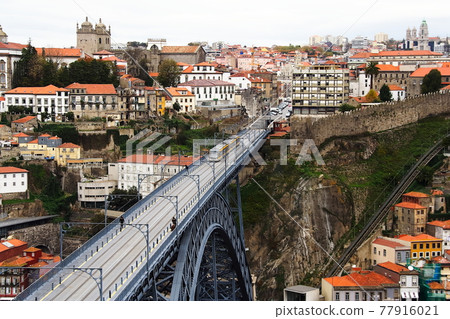 Don Luis I Bridge and tram over the Douro River in Porto, Portugal Don Luis I Bridge and tram over the Douro River in Porto, Portugal 77916021