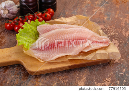 Raw tilapia fish Raw tilapia fish 77916503