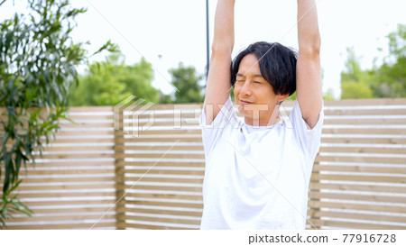 Men stretching outside Men stretching outside 77916728