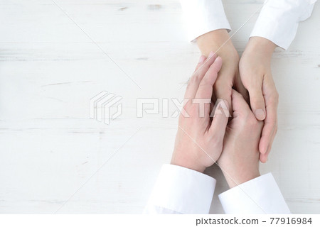 Hands of men and women 77916984
