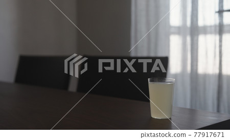 ginger beer in tumbler glass on walnut table indoor ginger beer in tumbler glass on walnut table indoor 77917671