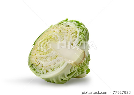 Cut off half of raw, pale green cabbage isolated on white background. Smooth-leafed vegetable, summer harvest. Close up, copy space 77917923
