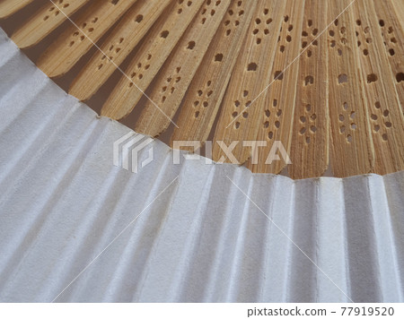 traditional japanese or chinese hand fan 77919520