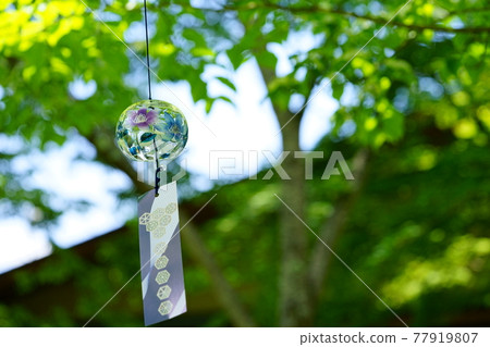 Wind chimes in the garden looking up at the roof 3 77919807