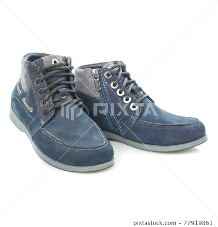 Men's blue leather boots isolated on a blue background. 77919861