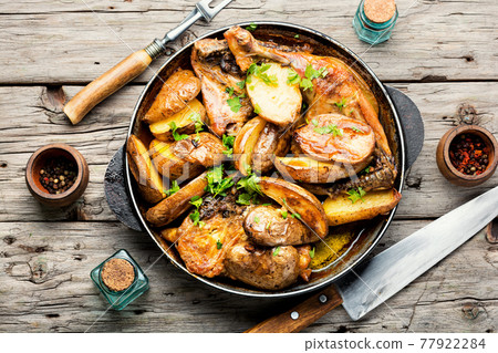 Chicken baked with potatoes in a pan,top view 77922284