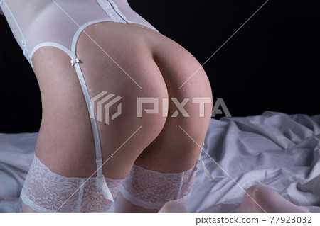 Image of woman in stockings with nude buttocks Image of woman in stockings with nude buttocks 77923032