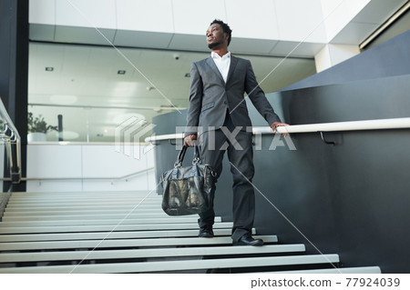 Successful African American Businessman in Lobby Successful African American Businessman in Lobby 77924039