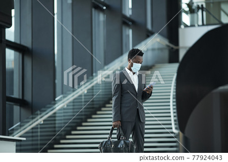 African American Businessman in Office Hall African American Businessman in Office Hall 77924043