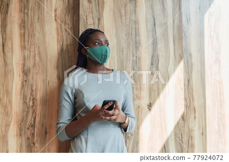 African American Businesswoman Wearing Mask 77924072