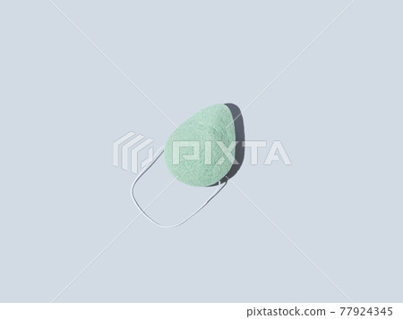 Green natural konjac sponge for face and body washing, zero waste sustainable product on blue Green natural konjac sponge for face and body washing, zero waste sustainable product on blue 77924345