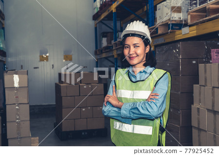 Portrait of young Asian woman warehouse worker smiling in the storehouse 77925452