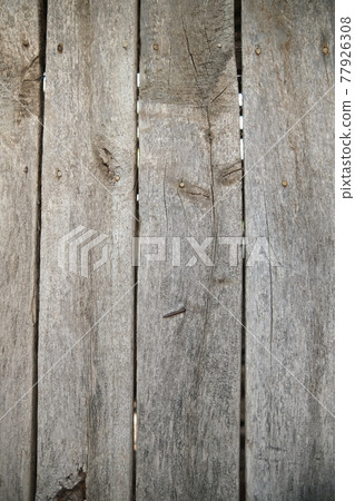 The texture of a wooden board on a wooden background. Wooden board with horizontal clapboard.. Gray burnt wood The texture of a wooden board on a wooden background. Wooden board with horizontal clapboard.. Gray burnt wood 77926308
