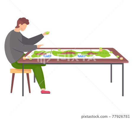 Man sitting on chair next to table with colored board game with green map, chips and coins 77926781