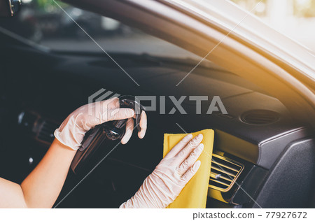 Woman hands using cloth cleaning inside a car,Safety and protect infection during covid-19 virus pandemic situation Woman hands using cloth cleaning inside a car,Safety and protect infection during covid-19 virus pandemic situation 77927672