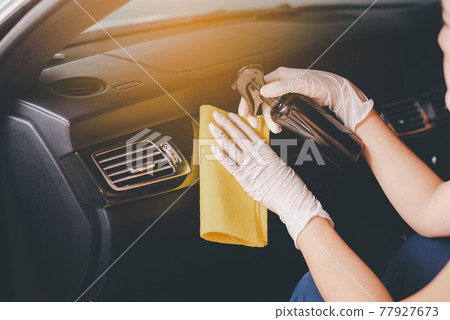 Woman hands using cloth cleaning inside a car,Safety and protect infection during covid-19 virus pandemic situation Woman hands using cloth cleaning inside a car,Safety and protect infection during covid-19 virus pandemic situation 77927673