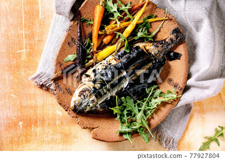 Grilled cooked fresh gutted sea bream or dorado fish Grilled cooked fresh gutted sea bream or dorado fish 77927804