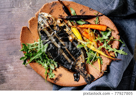 Grilled cooked fresh gutted sea bream or dorado fish Grilled cooked fresh gutted sea bream or dorado fish 77927805