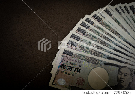 [Japanese yen] 10,000 yen, wad of bills, image [Finance] 77928583