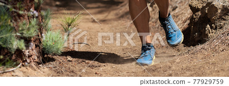 Trail running man on mountain path exercising Trail running man on mountain path exercising 77929759