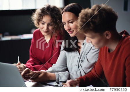Group of young people attending education class in community center. 77930860
