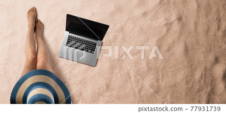 Flat lay top view of young woman with hat and laptop, summer holiday concept. Copy space. 77931739