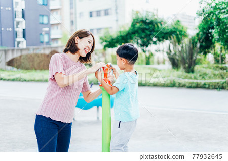 Little boy playing in the park with mom Little boy playing in the park with mom 77932645