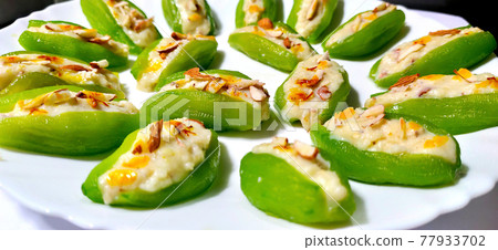 Pointed gourd sweets isolated in black background. 77933702