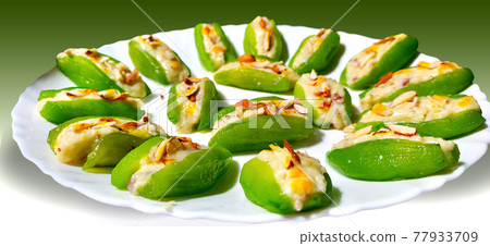 Pointed gourd sweets isolated in black background. 77933709