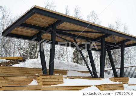 A massive wooden canopy from the sun, rain and snow on the observation platform. A massive wooden canopy from the sun, rain and snow on the observation platform. 77935769