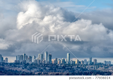 Overview of Metrotown center on stormy clouds background Overview of Metrotown center on stormy clouds background 77936014