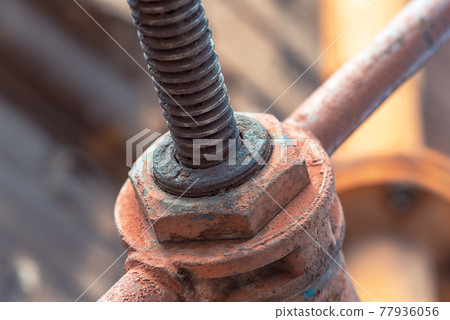 dirty gas valve with a yellow pipe on the wall of an old house dirty gas valve with a yellow pipe on the wall of an old house 77936056