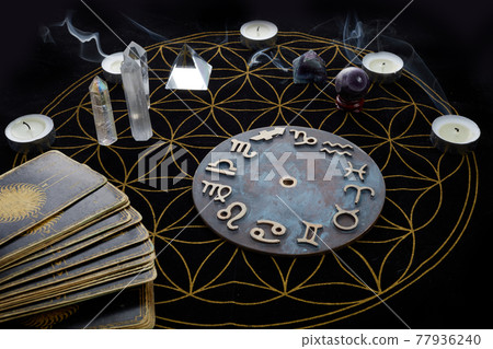 Fortune Telling Table with tarot cards and esoteric objects Fortune Telling Table with tarot cards and esoteric objects 77936240