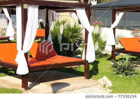 Beach bed at resort 77936294