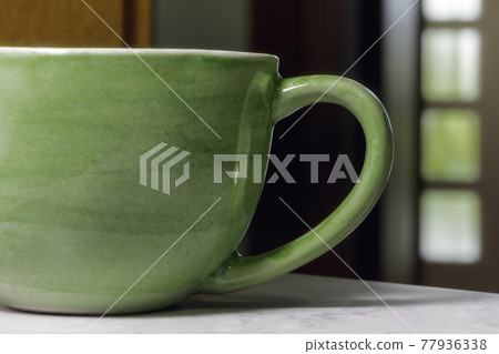 a modern green coffee mug 77936338