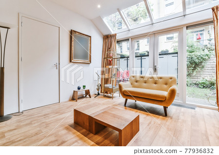 Spacious living room with window in ceiling Spacious living room with window in ceiling 77936832