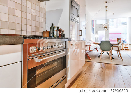 Gas stove in modern spacious kitchen Gas stove in modern spacious kitchen 77936833