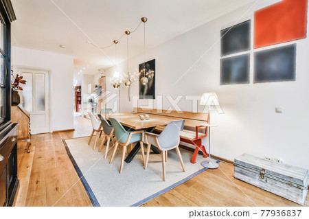 Cozy dining area with wooden bench 77936837