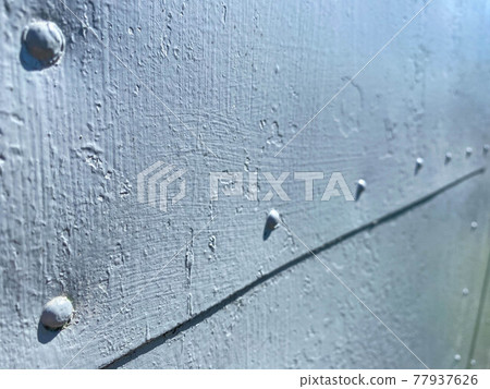 Rusty painted metal in blue. The texture of rust and blue stealing on a metal surface. Rusty Metal Background Rusty painted metal in blue. The texture of rust and blue stealing on a metal surface. Rusty Metal Background 77937626