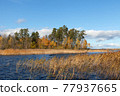 channel between two small islands, tranquil autumn landscape 77937665