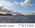 windy weather on an autumn lake with islands. 77937666